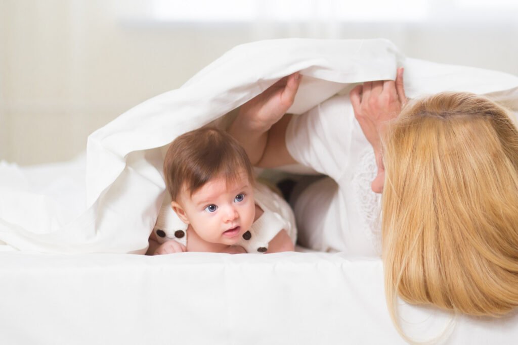 peek a boo activity for six-month-old using a blanket 